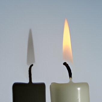 burning candle covered with glass
